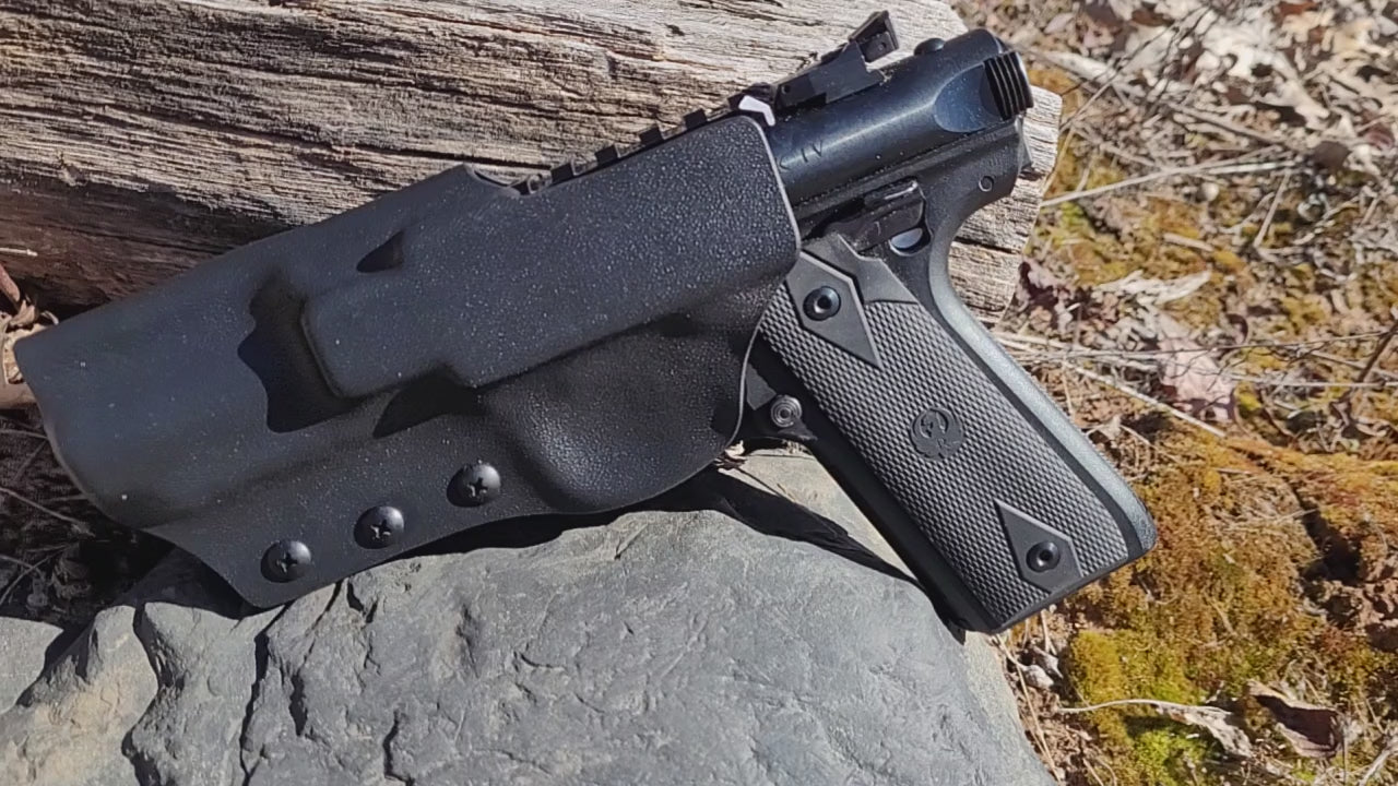 Video depicts the holster from various angles, showcasing the optic ready upper rail accessibility, the sleek, attractive design, and the purpose built geometry of the holster. 